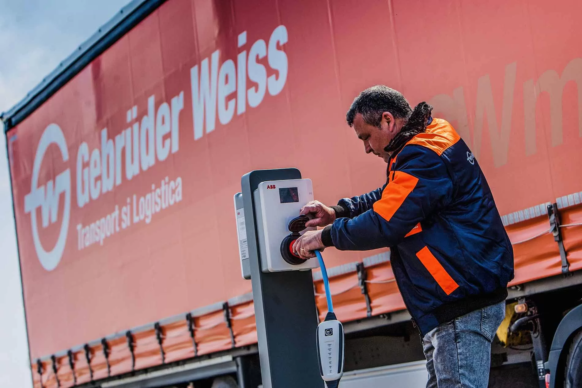 Driver charging the electric truck